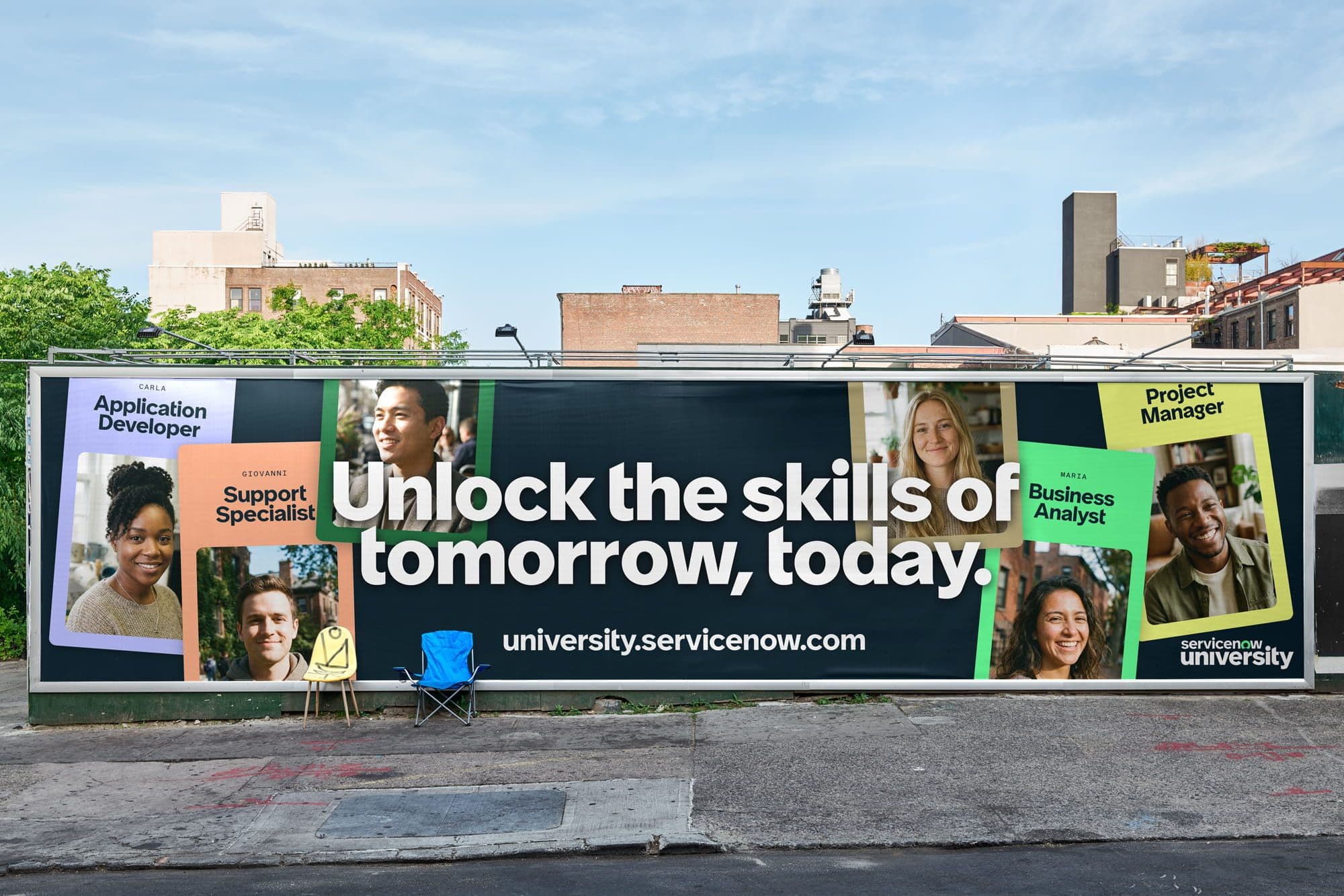 Billboard promoting ServiceNow University with diverse professionals' photos and titles: Application Developer, Support Specialist, Project Manager, Business Analyst. Text reads, "Unlock the skills of tomorrow, today."